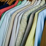 assorted polos tightly hanging in close up shot