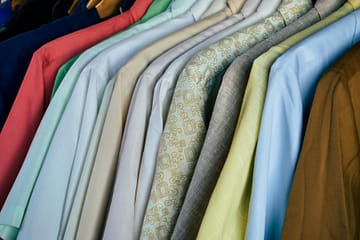 assorted polos tightly hanging in close up shot